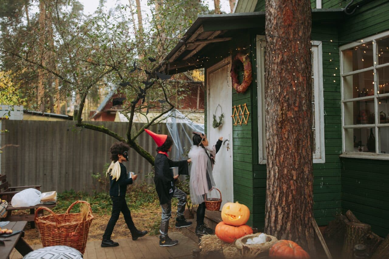 Group of kids trick-or-treating for Halloween.