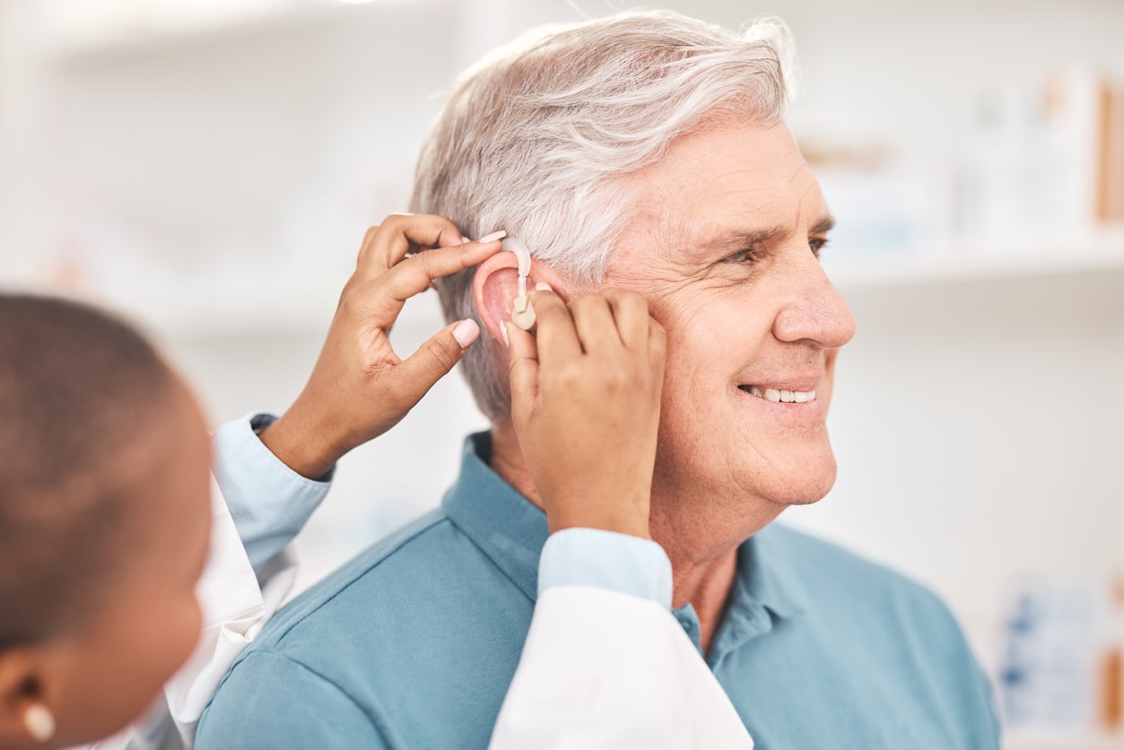 Happy man at his hearing aid fitting.