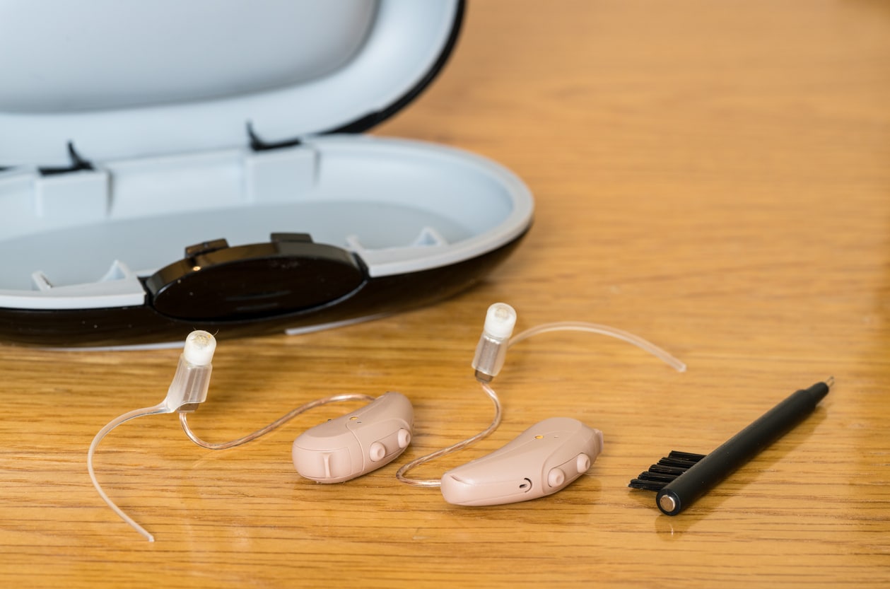 Hearing aids and cleaning brush.