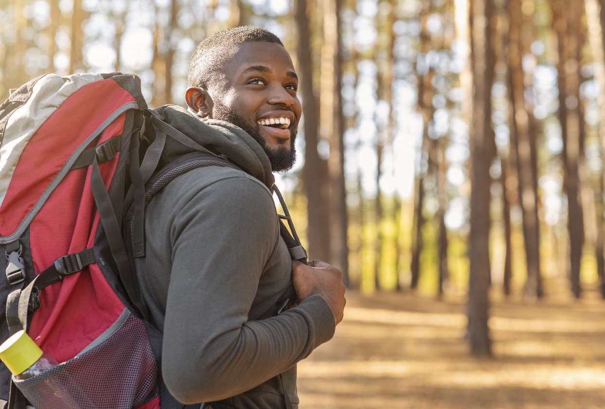 Happy man on a nature hike.