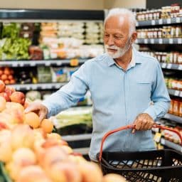 Senior man grocery shopping