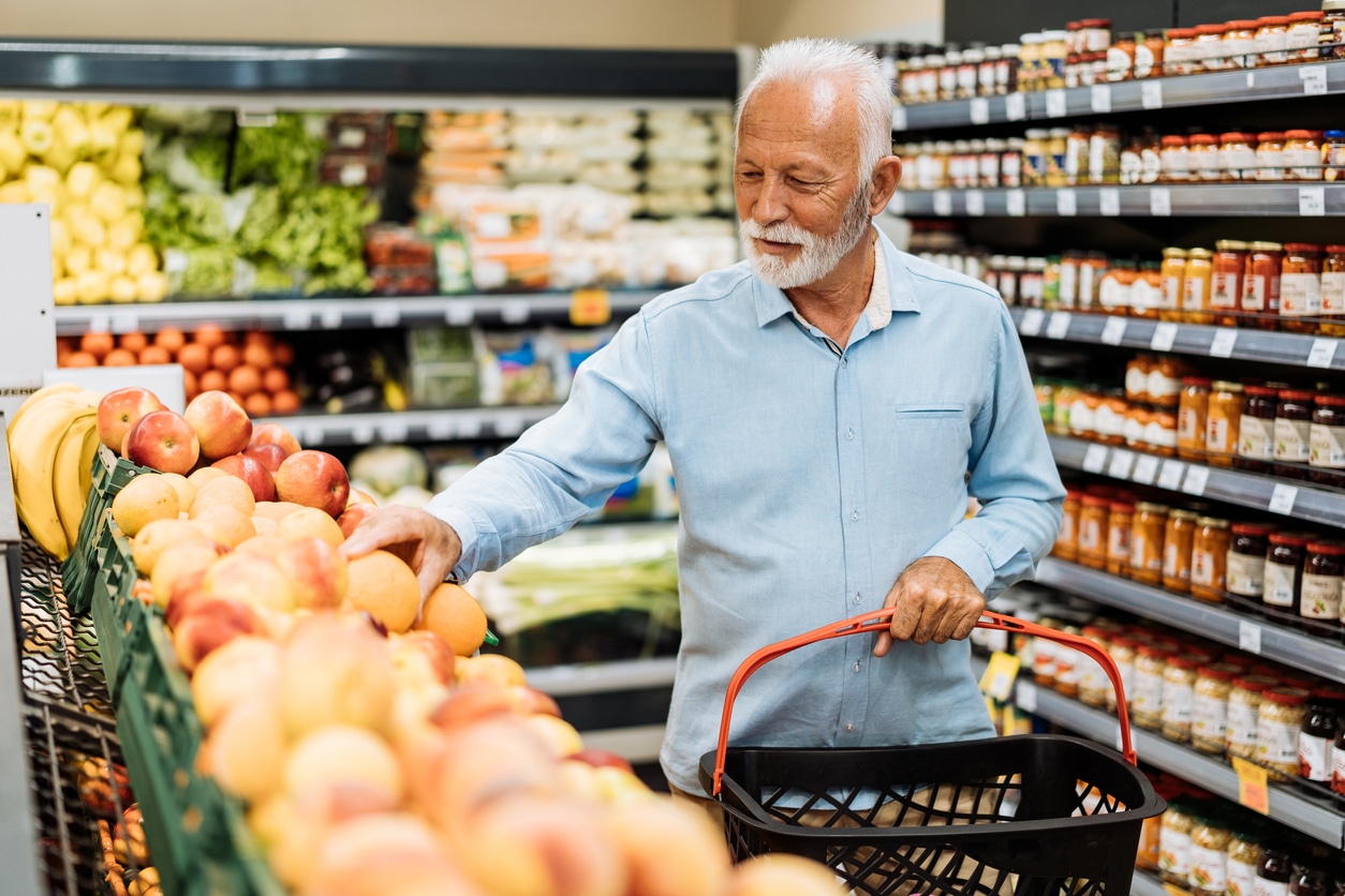 Senior man grocery shopping